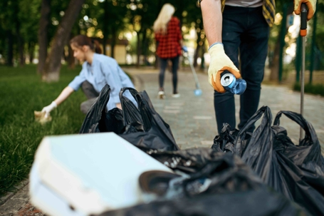 volunteers picking up trash in park